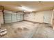 Spacious garage with ample room for parking and storage, featuring a roll-up door at 3932 E Tierra Buena E Ln, Phoenix, AZ 85032