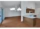 Bright and open kitchen connects to living spaces; features white countertops and lots of light at 3932 E Tierra Buena E Ln, Phoenix, AZ 85032