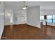 Open-concept living space with wood floors and ample natural light connecting to the kitchen at 3932 E Tierra Buena E Ln, Phoenix, AZ 85032