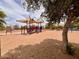 Colorful playground featuring slides and climbing structures set in a sandy play area at 3932 E Tierra Buena E Ln, Phoenix, AZ 85032