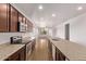 Kitchen has granite countertops, a kitchen island, and lots of room for cooking and entertaining at 41103 W Rio Bravo Dr, Maricopa, AZ 85138