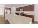 Modern kitchen with an island, stainless steel appliances, and plenty of cabinet storage for all your needs at 41103 W Rio Bravo Dr, Maricopa, AZ 85138