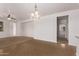 The open living room flows into the dining area, creating a great space for entertaining or Gathering gatherings at 41103 W Rio Bravo Dr, Maricopa, AZ 85138