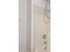 Close up of a shower with tile walls, a showerhead and new fixtures at 41103 W Rio Bravo Dr, Maricopa, AZ 85138