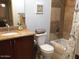 Modern bathroom featuring shower-tub combo with neutral tile, granite vanity, and updated fixtures at 4120 N 78Th St # 116, Scottsdale, AZ 85251