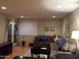Living room with carpet, couch, television, lighting, and outdoor access at 4120 N 78Th St # 116, Scottsdale, AZ 85251
