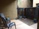 Private outdoor patio featuring neutral paint, stone accent wall and small rock garden at 4120 N 78Th St # 116, Scottsdale, AZ 85251