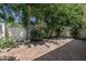 View of the brick patio with a grass area and mature shade trees at 4226 N 69Th Pl, Scottsdale, AZ 85251