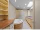 Bathroom boasts a jacuzzi tub, tile floors, granite countertops, and a double sink vanity at 4226 N 69Th Pl, Scottsdale, AZ 85251