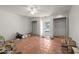 Large, terra cotta-tiled bedroom with dual closets, ceiling fan, and walk-out door at 4226 N 69Th Pl, Scottsdale, AZ 85251