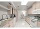 Long kitchen with abundant cabinet space and modern appliances at 4226 N 69Th Pl, Scottsdale, AZ 85251