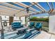 Relaxing patio with comfortable seating under a pergola, perfect for outdoor entertaining and leisure at 4226 N 69Th Pl, Scottsdale, AZ 85251