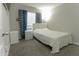 Bedroom with a bed, storage, soft carpet, and natural light from the window at 4255 N 68Th Dr, Phoenix, AZ 85033
