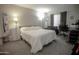 Bedroom features plush carpeting, neutral walls, and a large window providing ample natural light at 4255 N 68Th Dr, Phoenix, AZ 85033