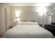 Bright bedroom featuring light-colored walls, a large bed, and soft carpeting throughout at 4255 N 68Th Dr, Phoenix, AZ 85033