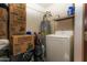 Functional laundry room featuring a modern washer and utility storage at 4255 N 68Th Dr, Phoenix, AZ 85033
