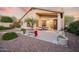 Charming backyard patio with lush greenery, tasteful landscaping, and desert stone at 4462 E Dale Ln, Cave Creek, AZ 85331