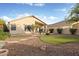 Large backyard with artificial grass, desert landscaping, a built in BBQ and patio at 4462 E Dale Ln, Cave Creek, AZ 85331