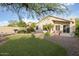 Backyard with artificial grass, desert landscaping, a built in BBQ and patio at 4462 E Dale Ln, Cave Creek, AZ 85331