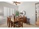 Dining room featuring a wooden table with six chairs, large window and buffet at 4462 E Dale Ln, Cave Creek, AZ 85331