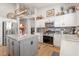 Bright kitchen with granite island, stainless steel appliances, and ample storage in white cabinets at 4462 E Dale Ln, Cave Creek, AZ 85331
