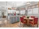 Bright kitchen features an island with granite countertops, a breakfast nook, and wooden floors at 4462 E Dale Ln, Cave Creek, AZ 85331