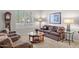 Comfortable living room with plush seating, decorative pillows, and a bright window view at 4462 E Dale Ln, Cave Creek, AZ 85331