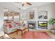 Inviting living room featuring a fireplace, neutral palette, and access to kitchen at 4462 E Dale Ln, Cave Creek, AZ 85331