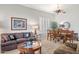 Comfortable living space with cozy seating, plantation shutters, and view of dining area at 4462 E Dale Ln, Cave Creek, AZ 85331