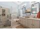 Elegant bathroom with dual vanities, soaking tub, and a glass-enclosed shower at 4462 E Dale Ln, Cave Creek, AZ 85331