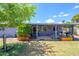 Backyard showcases the covered patio, green lawn, and mature landscaping at 4626 W Altadena Ave, Glendale, AZ 85304