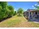 Spacious backyard features mature trees, a covered patio, and a lush green lawn at 4626 W Altadena Ave, Glendale, AZ 85304