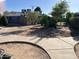 Spacious backyard featuring a sidewalk, storage shed, and mature landscaping at 4626 W Altadena Ave, Glendale, AZ 85304