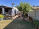 Well-maintained backyard with grass, gravel and mature trees at 4626 W Altadena Ave, Glendale, AZ 85304