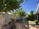 Landscaped backyard features mature trees, a fire pit, and green grass at 4626 W Altadena Ave, Glendale, AZ 85304