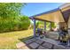 Backyard featuring covered patio, well maintained lawn, and lush foliage at 4626 W Altadena Ave, Glendale, AZ 85304