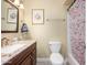Bathroom features a vanity with marble countertops and a framed mirror at 4626 W Altadena Ave, Glendale, AZ 85304