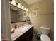 Bathroom featuring granite countertops, a large mirror, and a standard toilet at 4626 W Altadena Ave, Glendale, AZ 85304
