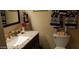 A bathroom with decorative towels hanging and a sink with granite counters at 4626 W Altadena Ave, Glendale, AZ 85304