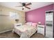 Cozy bedroom with bright wall, ceiling fan, and comfortable bedding and linens at 4626 W Altadena Ave, Glendale, AZ 85304