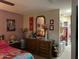 Comfortable bedroom with a dresser, mirror, and a glimpse into a closet area at 4626 W Altadena Ave, Glendale, AZ 85304