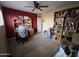 Room with shelving, with bed, chair, carpet and ceiling fan and an open doorway at 4626 W Altadena Ave, Glendale, AZ 85304