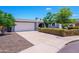 Charming home with a well-manicured front yard, mature trees, and a two-car garage at 4626 W Altadena Ave, Glendale, AZ 85304
