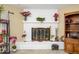 Brick fireplace with decor and wood storage at 4626 W Altadena Ave, Glendale, AZ 85304
