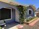 Inviting entryway with an arched trellis, brick planter, and wrought-iron security door at 4626 W Altadena Ave, Glendale, AZ 85304