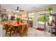 Eat-in kitchen with light wood cabinets, table and seating and sliding glass door to patio at 4626 W Altadena Ave, Glendale, AZ 85304