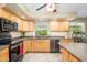 Bright kitchen features wood cabinets, modern stainless appliances, and neutral countertops at 4626 W Altadena Ave, Glendale, AZ 85304