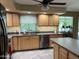 Updated kitchen featuring stainless steel dishwasher, cabinets, and natural lighting at 4626 W Altadena Ave, Glendale, AZ 85304