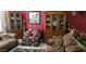 Cozy living room with comfortable seating, decor, and display cabinets on a tiled floor at 4626 W Altadena Ave, Glendale, AZ 85304