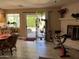 A spacious living room with tile flooring, dining area, and access to the backyard at 4626 W Altadena Ave, Glendale, AZ 85304
